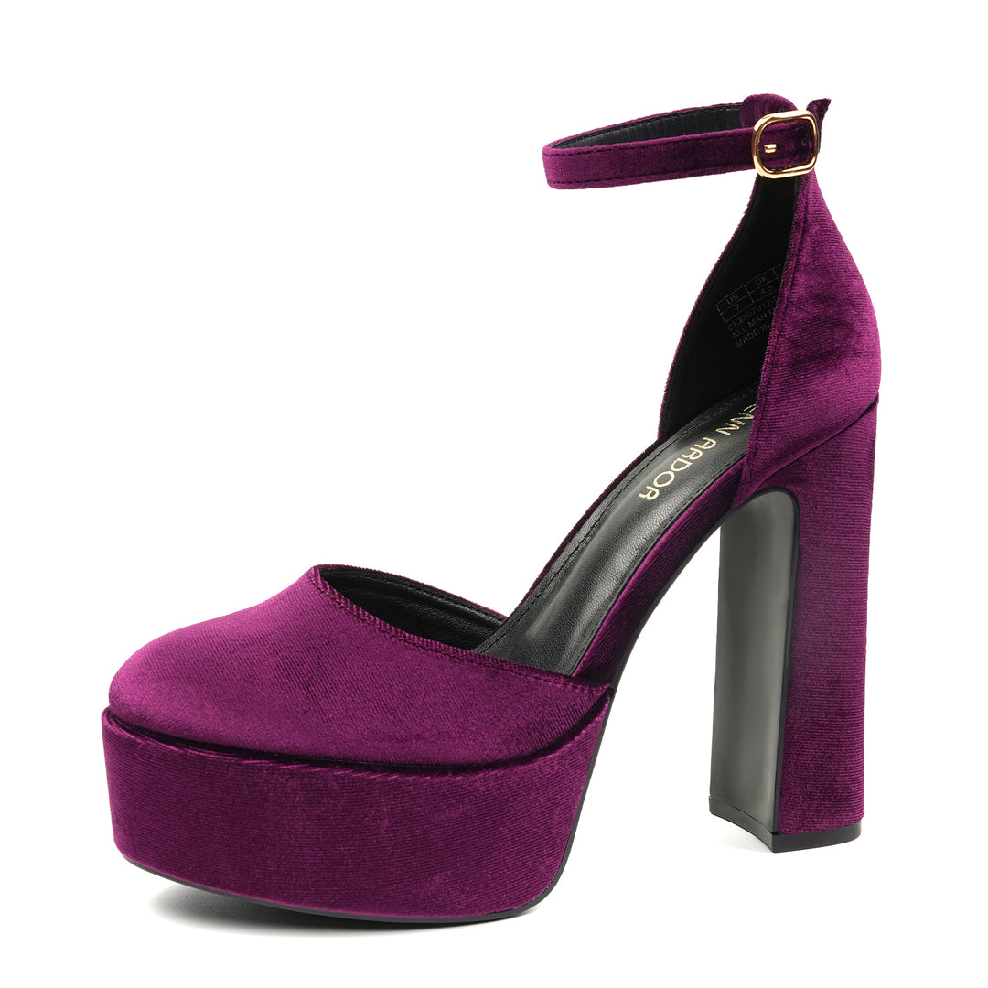A black faux leather platform heel pump with an ankle strap and chunky high heel, suitable for dressy occasions such as weddings or parties.#color_burgundy