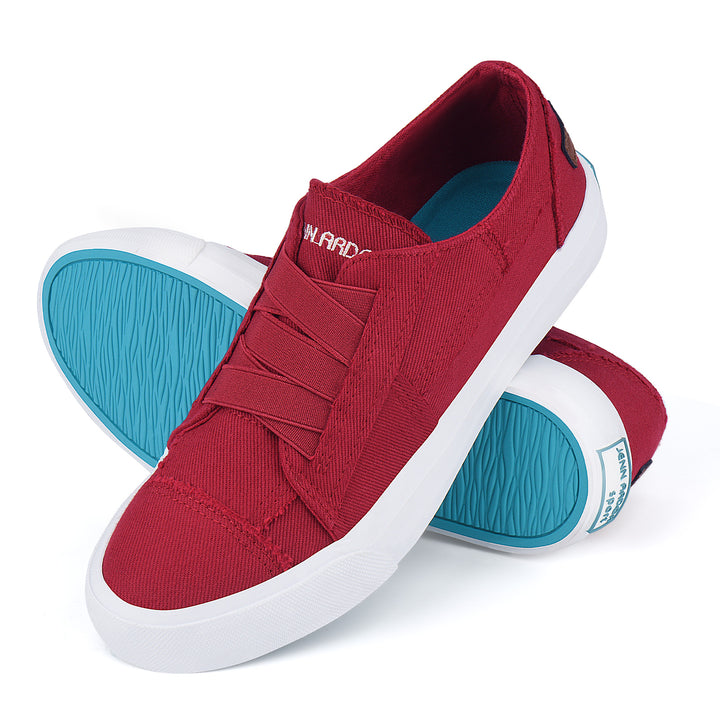 Red slip-on sneakers with blue soles on a white background#color_red