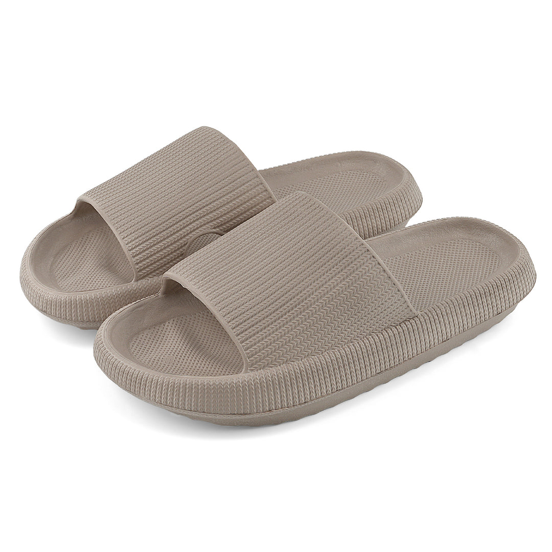 A pair of taupe-colored slide sandals with a ribbed strap and textured footbeds, shown on a clean white background.#color_herringbone-khaki
