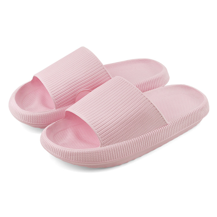 A pair of light pink slide sandals with a ribbed strap and textured footbeds, shown on a clean white background.#color_herringbone-pink