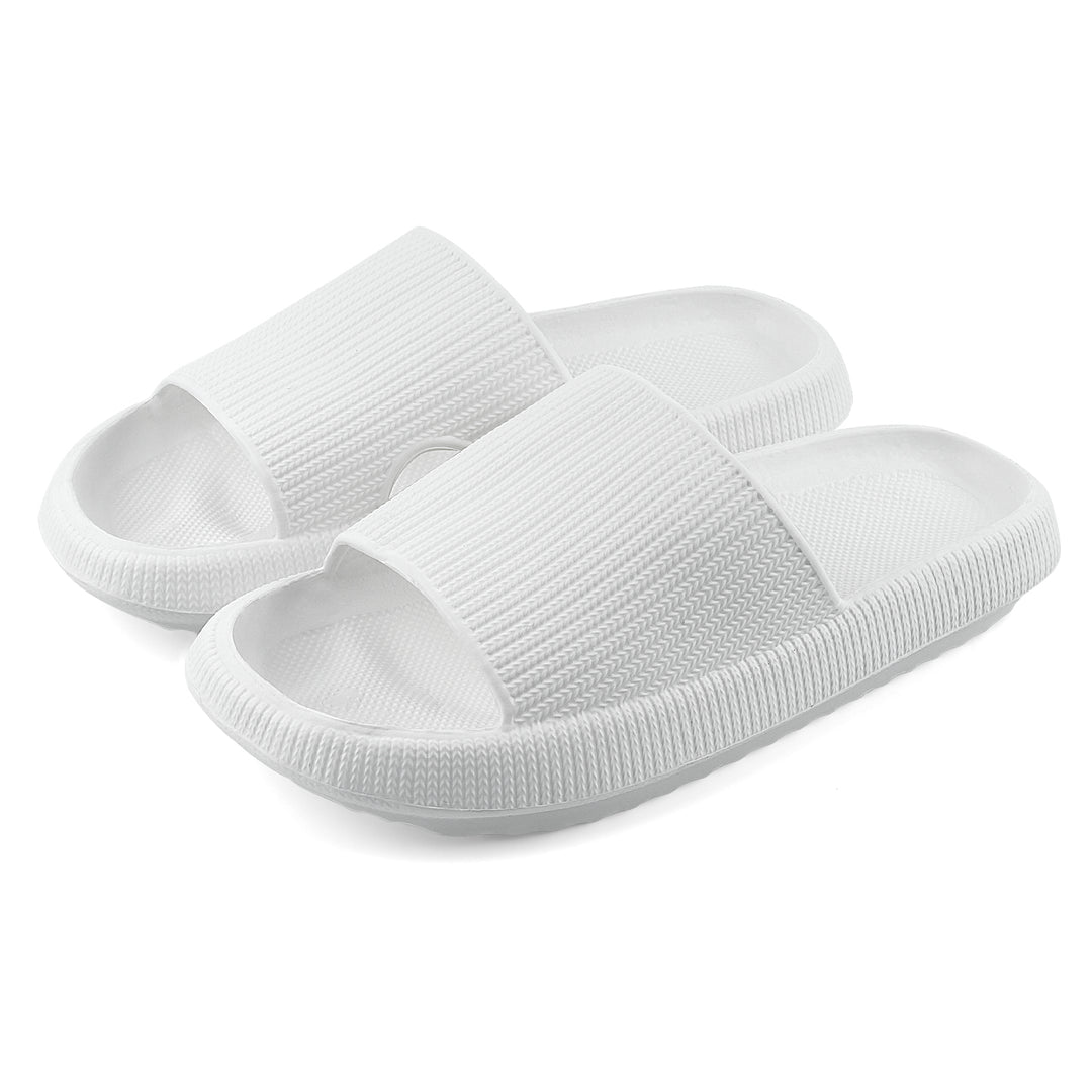 A pair of white slide sandals with a ribbed strap and textured sole, shown on a clean white background.#color_herringbone-white