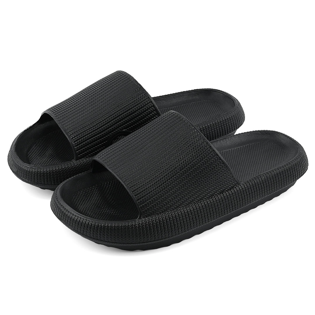 A pair of black slide sandals with textured straps and ridged soles, shown on a plain white background.#color_herringbone-black