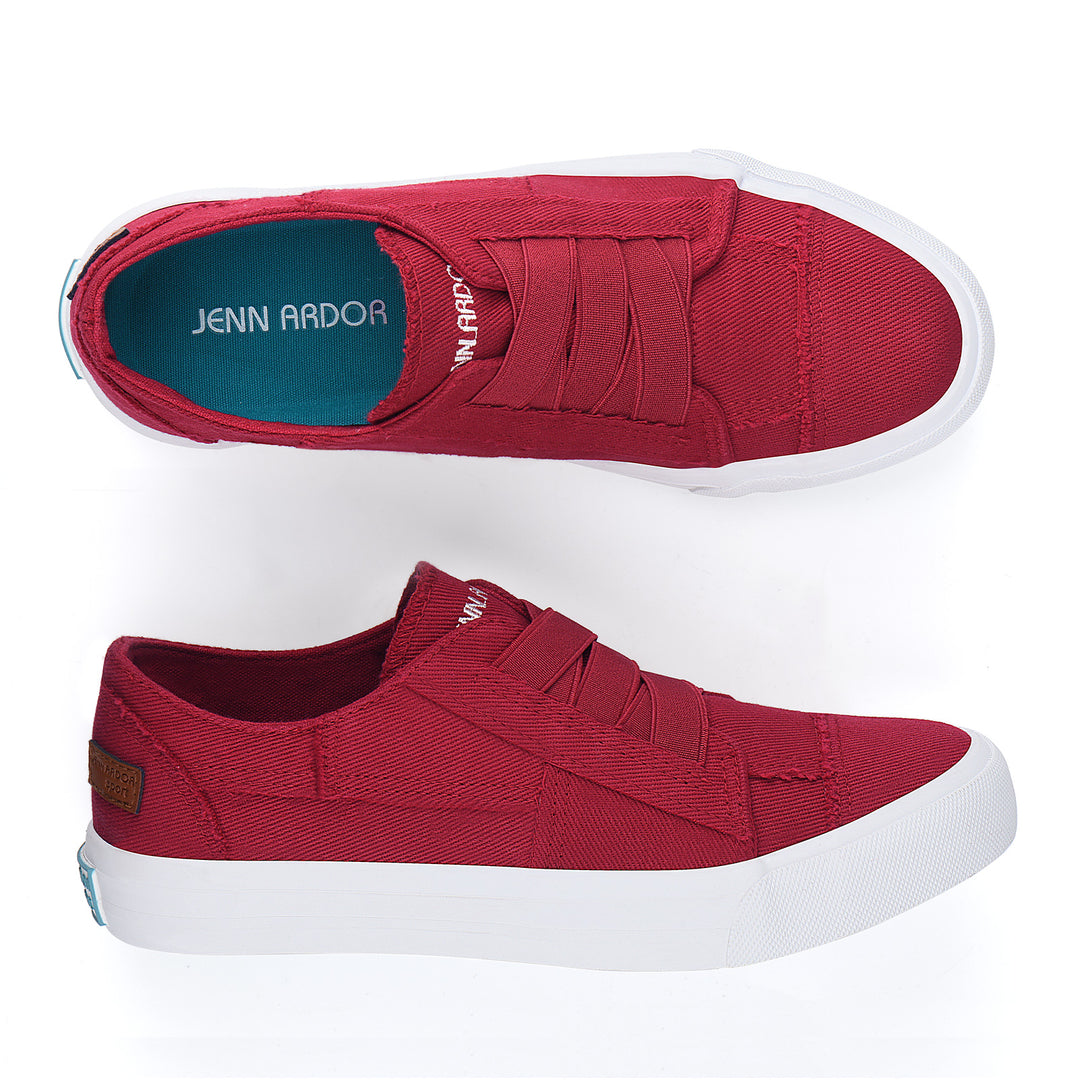 Red slip-on sneakers with white soles on a white background#color_red