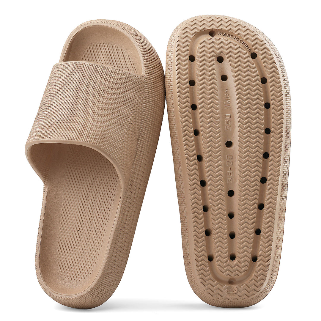 Beige slide sandal with textured sole on a white background#color_brown