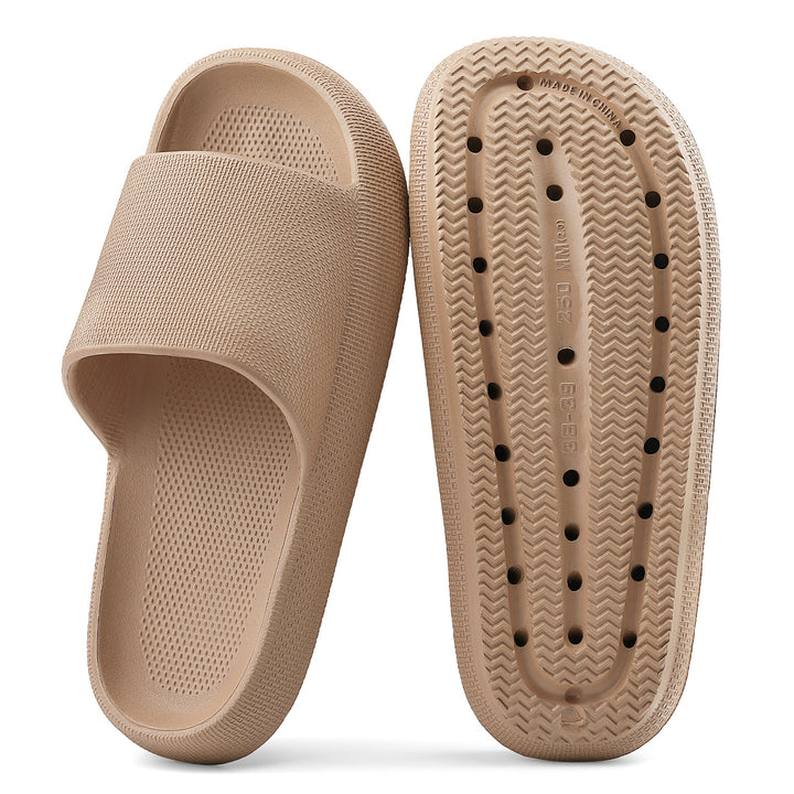 Beige slide sandal with textured sole on a white background#color_brown