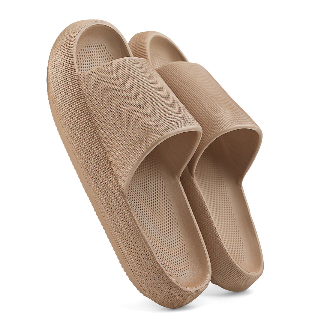 Pair of beige slippers on a white background#color_brown