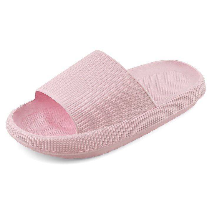 A single light pink slide sandal with a textured, ribbed strap and matching footbed, shown from a three-quarters angle on a white background.#color_herringbone-pink