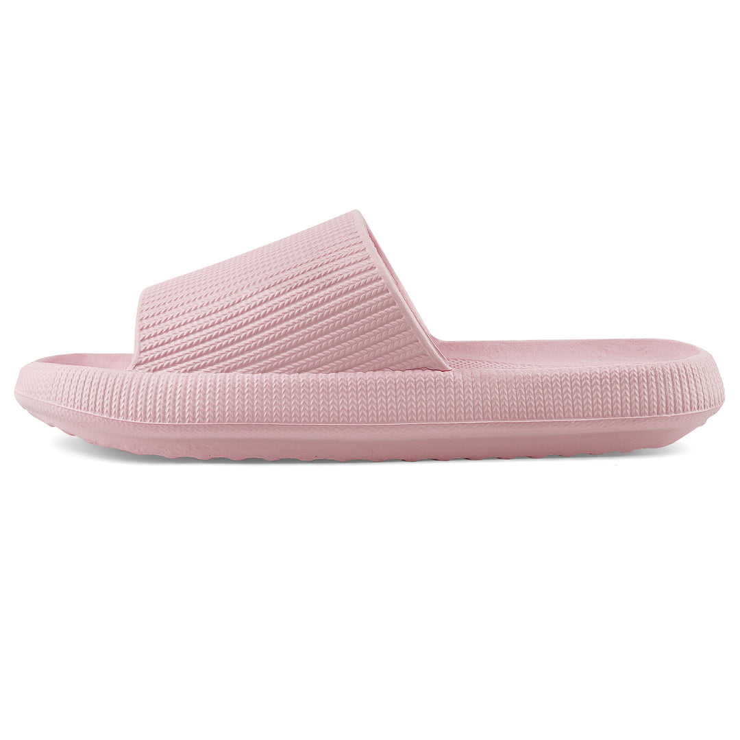 A single light pink slide sandal with a textured strap and ridged sole, shown in a side profile on a white background.#color_herringbone-pink
