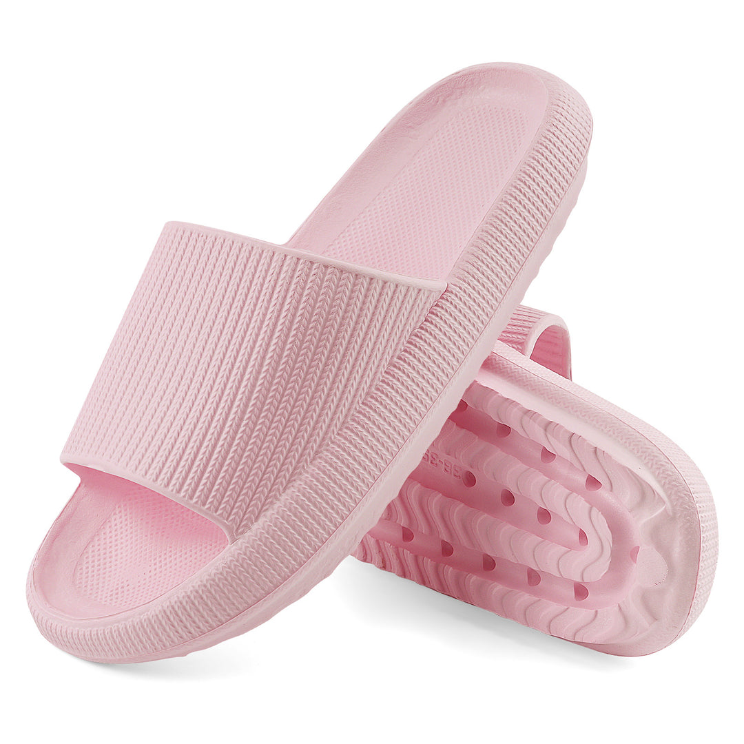 A pair of light pink slide sandals with textured straps and wavy, cushioned soles, shown on a clean white background.#color_herringbone-pink
