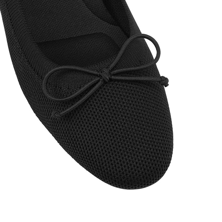 Black ballet flat shoe with a bow on a white background#color_black