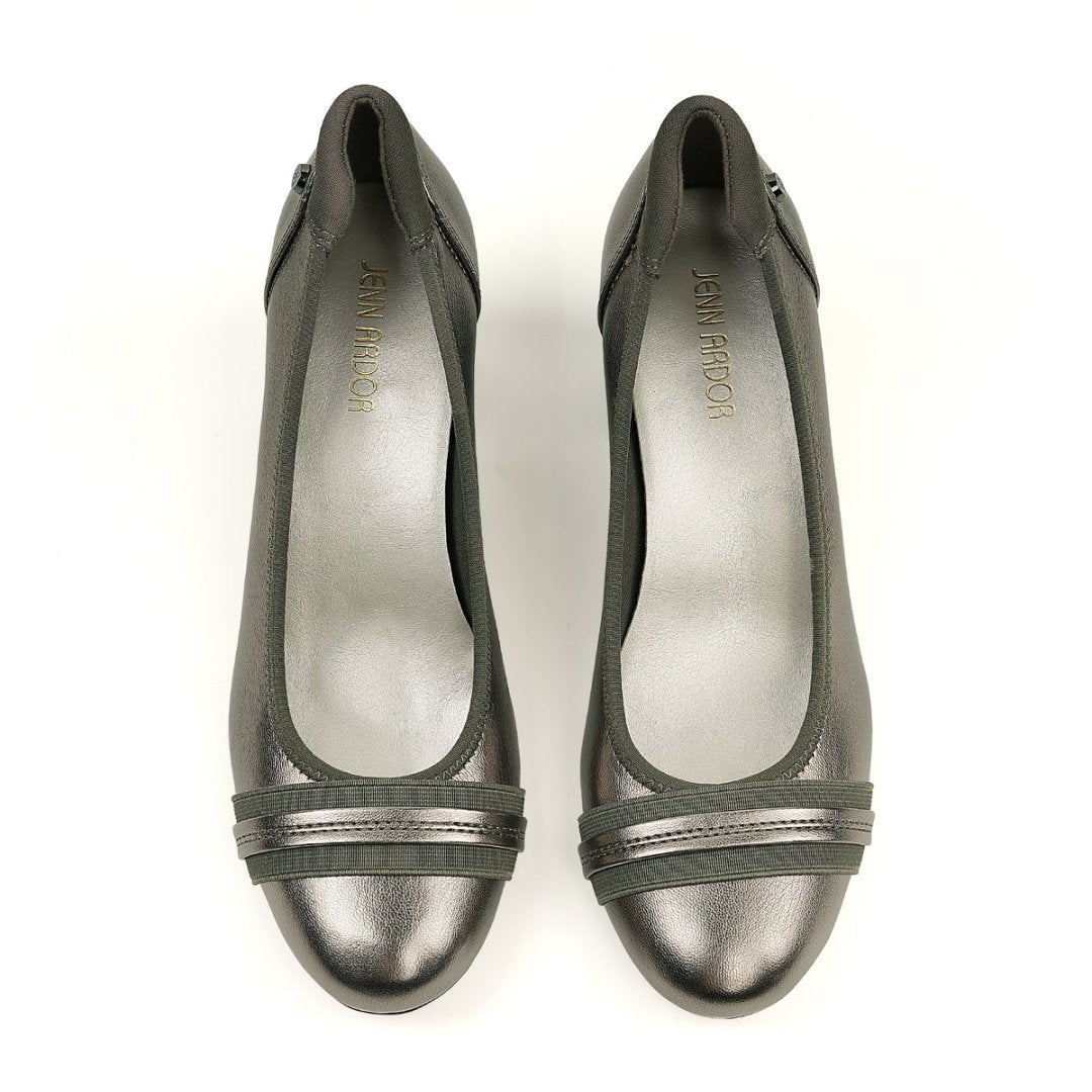 Pair of metallic silver shoes on a white background#color_pewter