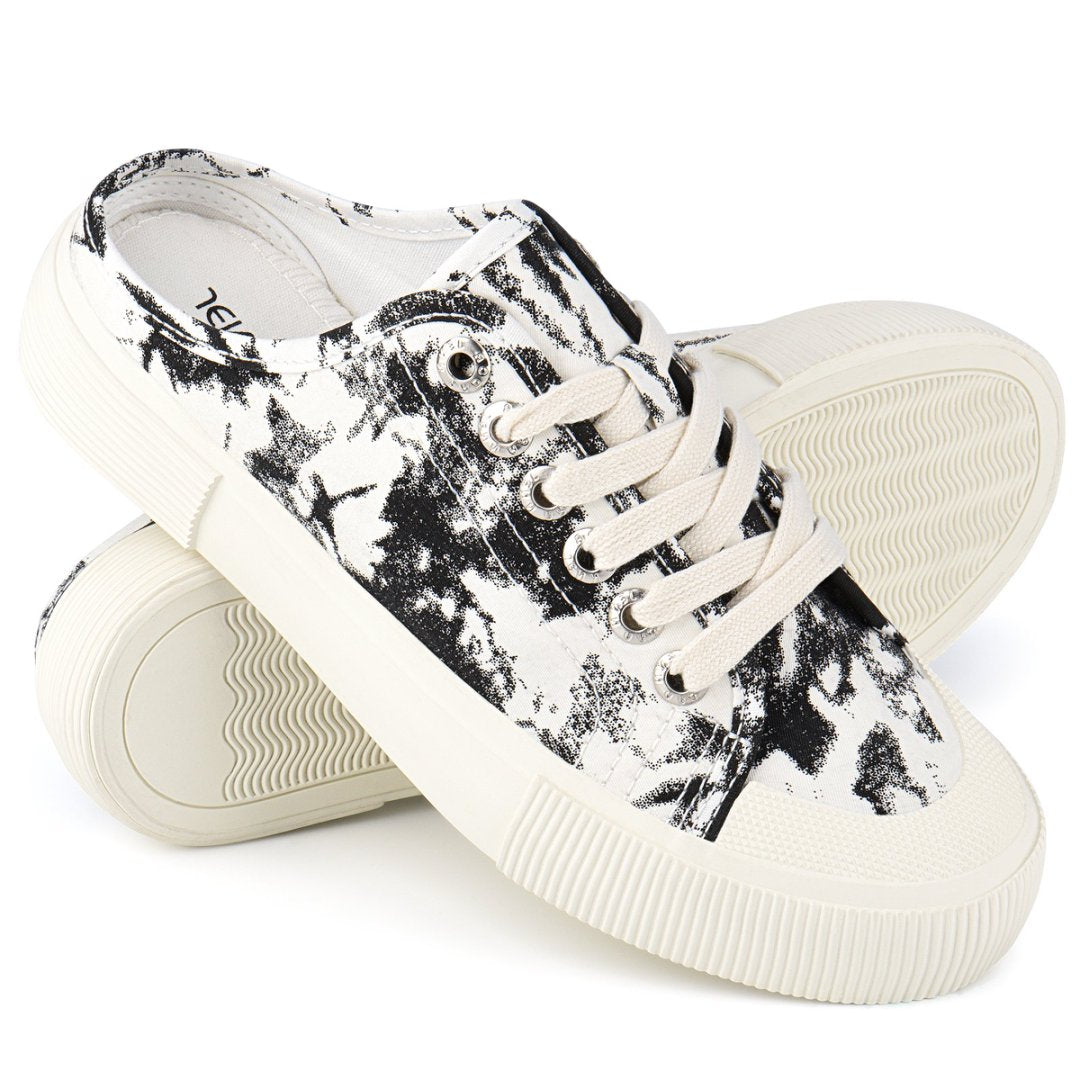 Pair of black and white sneakers on a white background#color_black-tie-dye