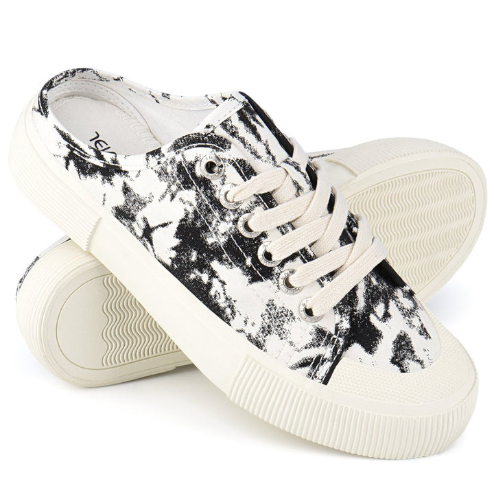 Pair of black and white sneakers on a white background#color_black-tie-dye