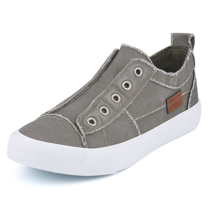 Gray slip-on sneaker with white sole on a light gray background#color_grey1