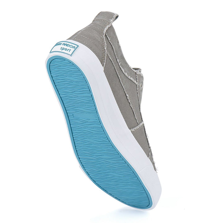 Gray slip-on shoe with blue sole on a white background#color_grey1