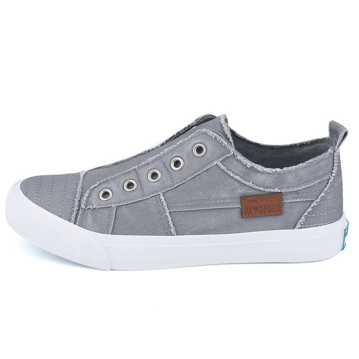 Gray casual shoe with a brand label on a white background#color_light-grey