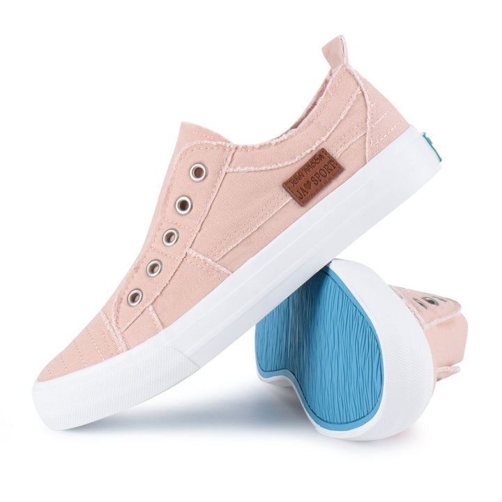 Pink sneakers with white soles and blue sole inserts on a white background#color_pink