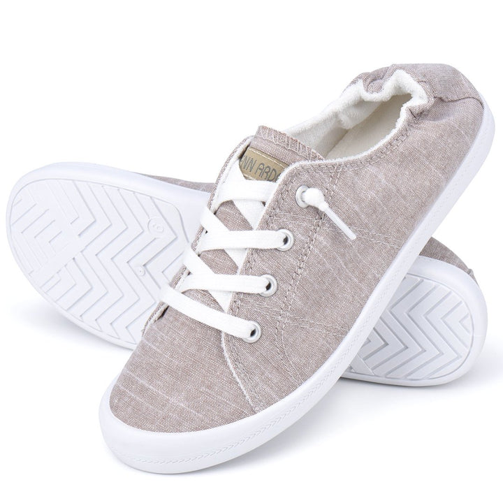 Pair of gray sneakers with white laces on a white background#color_light-grey