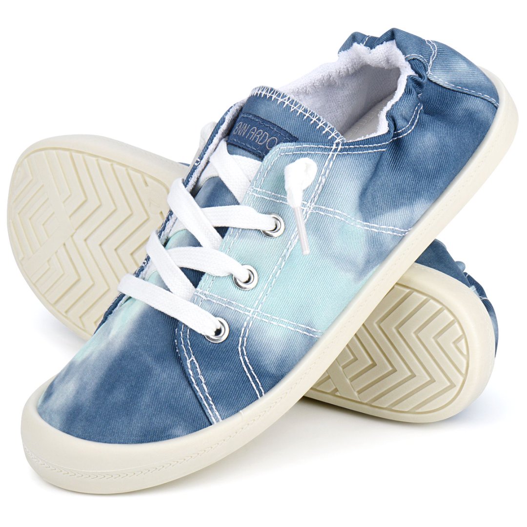 Pair of blue denim sneakers with white laces on a white background#color_blue-tie-dye