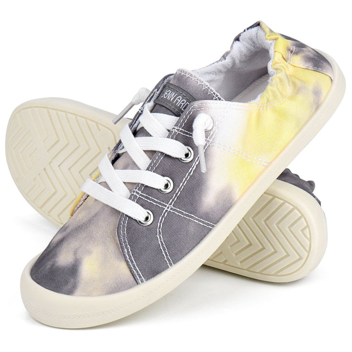 Gray and yellow tie-dye sneakers with white laces on a white background#color_grey-yellow-tie-dye