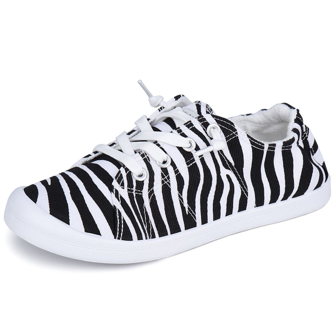 Black and white zebra-striped sneaker on a white background#color_zebra