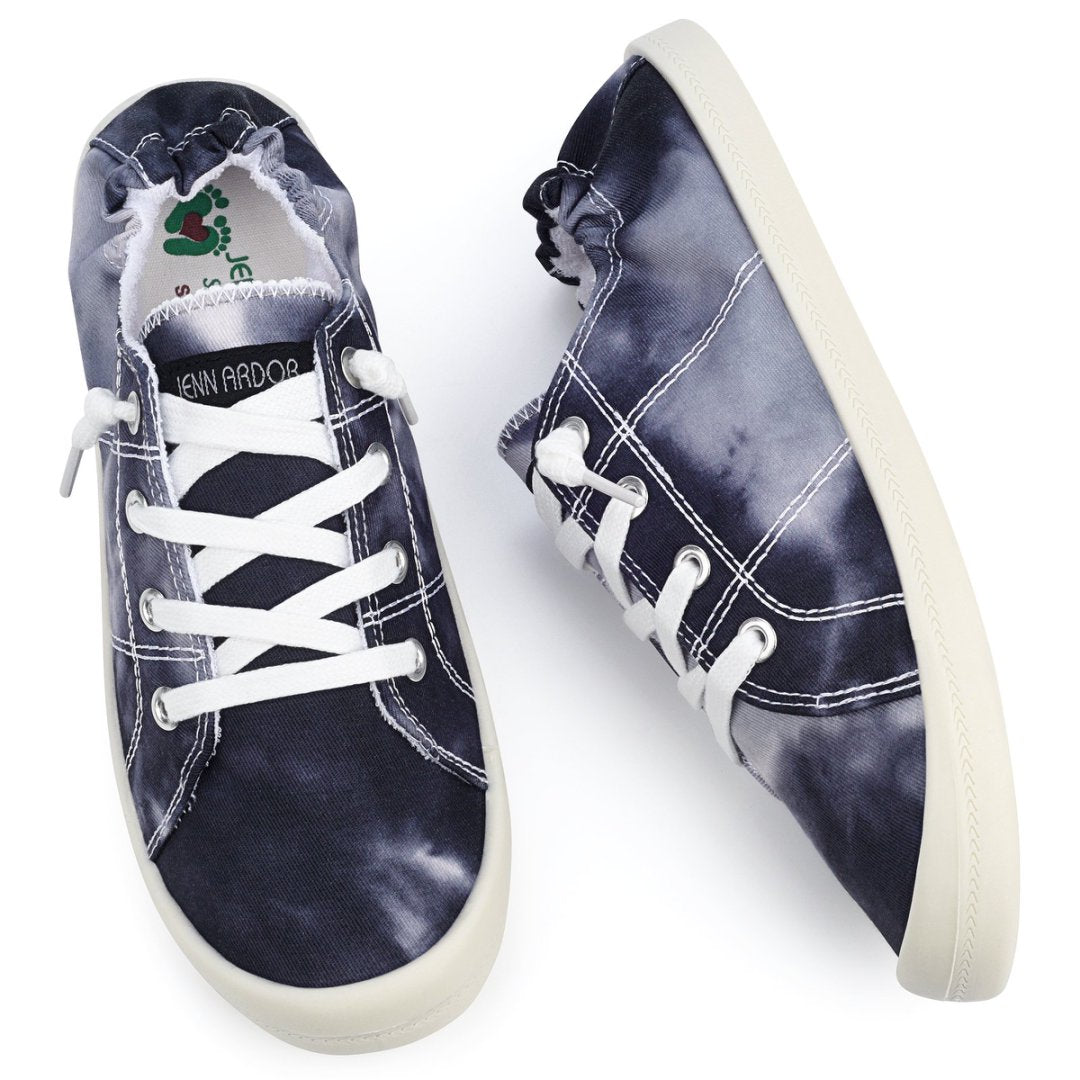 Pair of blue tie-dye sneakers with white laces on a white background#color_black-tie-dye