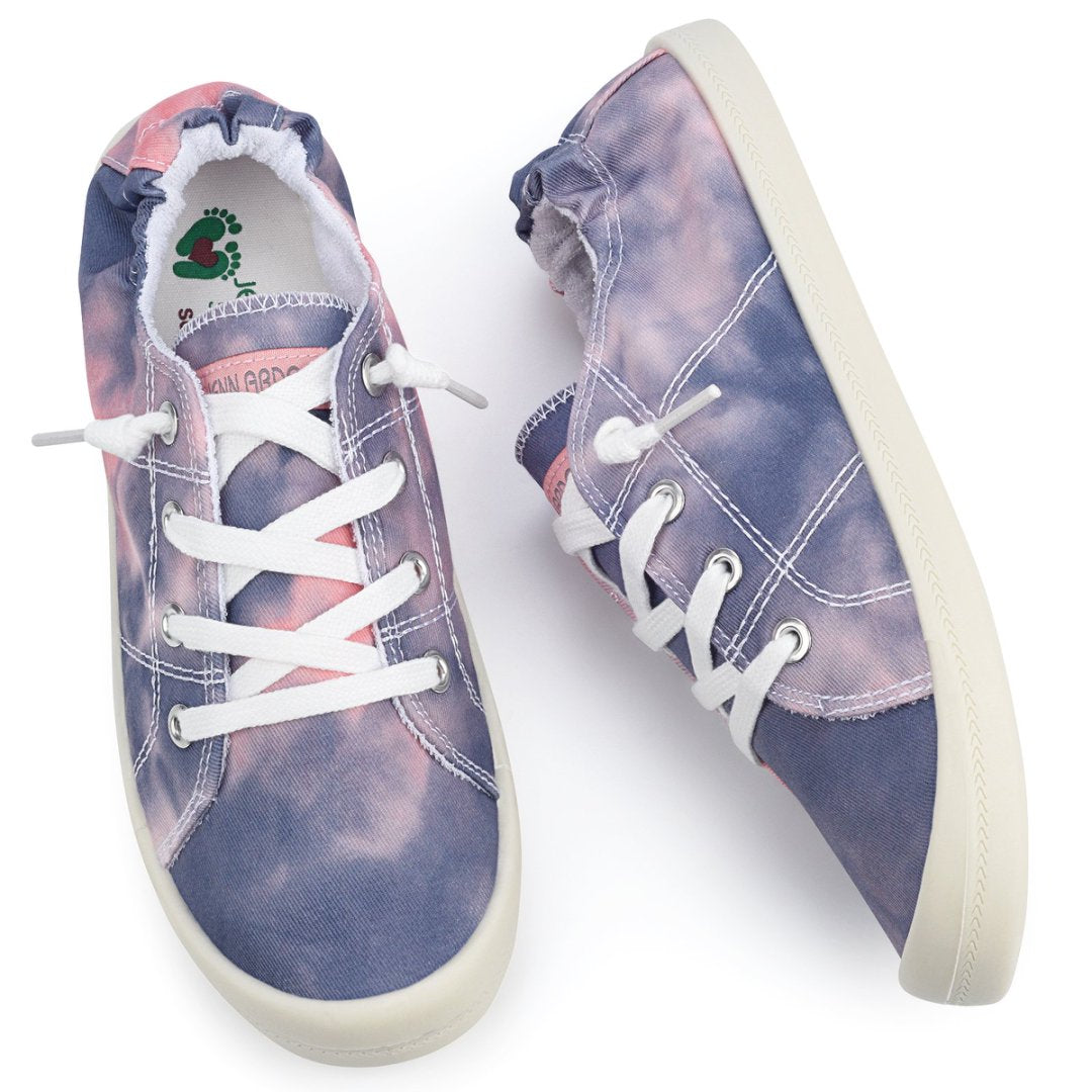 Pair of tie-dye sneakers with white laces on a white background#color_purple-pink-tie-dye