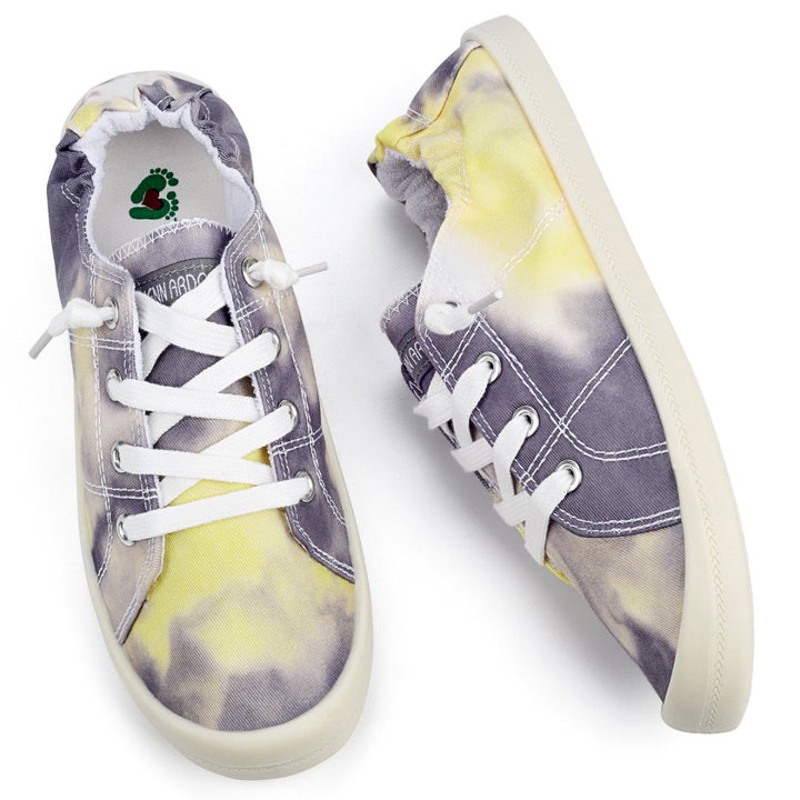 Tie-dye sneakers with white laces on a white background#color_grey-yellow-tie-dye
