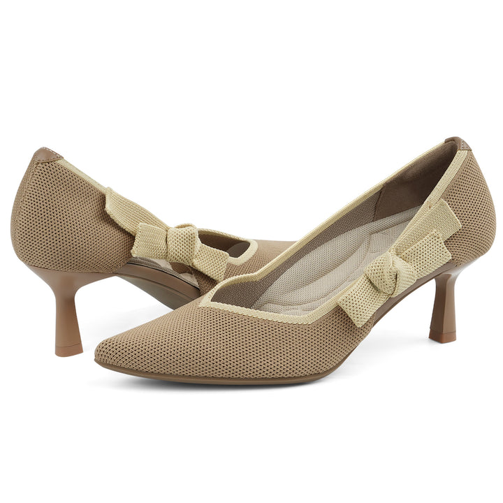 Pair of beige high-heeled shoes with bow details on a white background#color_nude