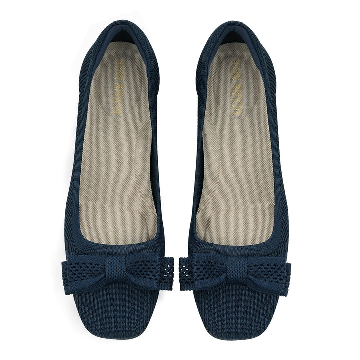 Pair of navy blue flats with bow details on a white background#color_navy