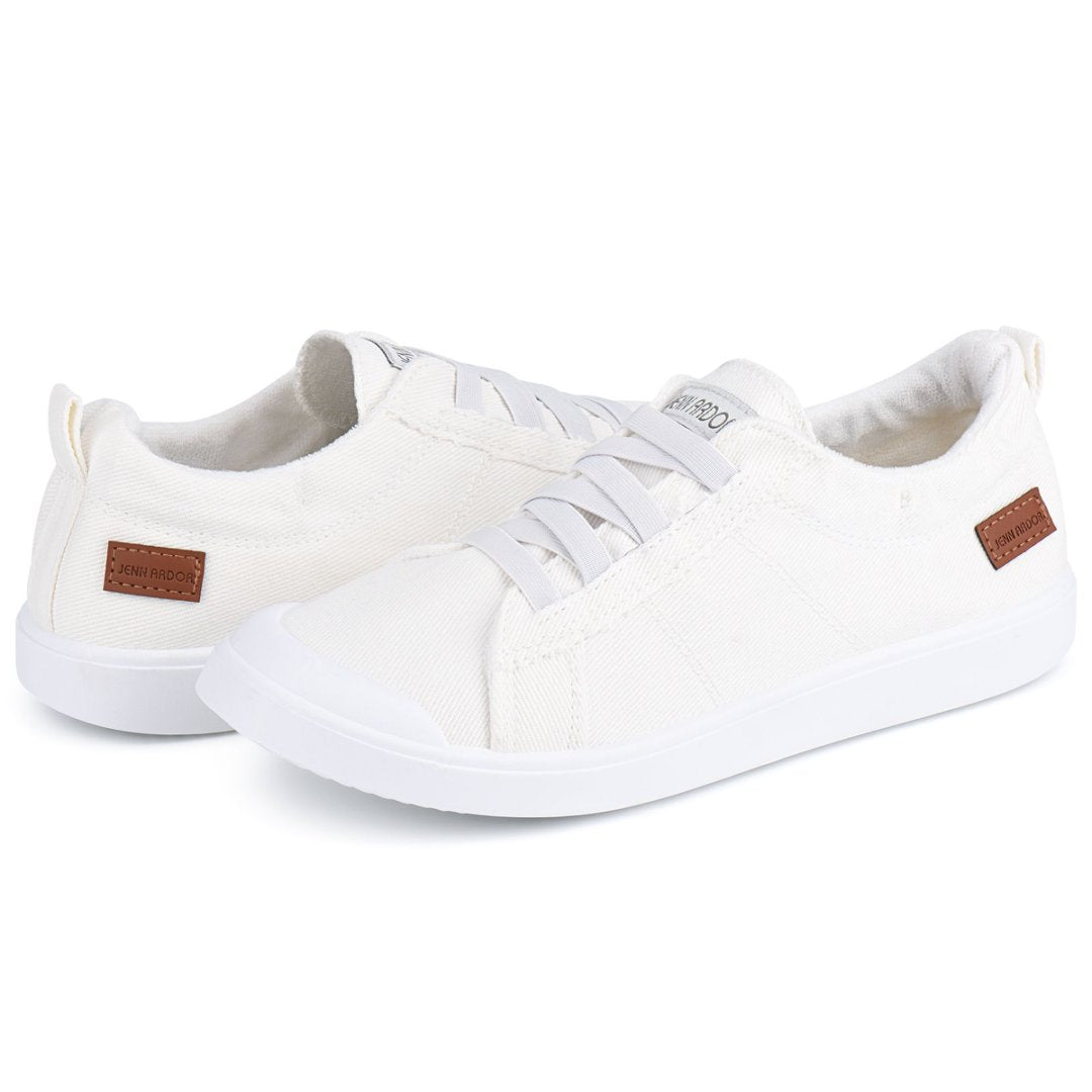 White sneakers with brown accents on a white background#color_white